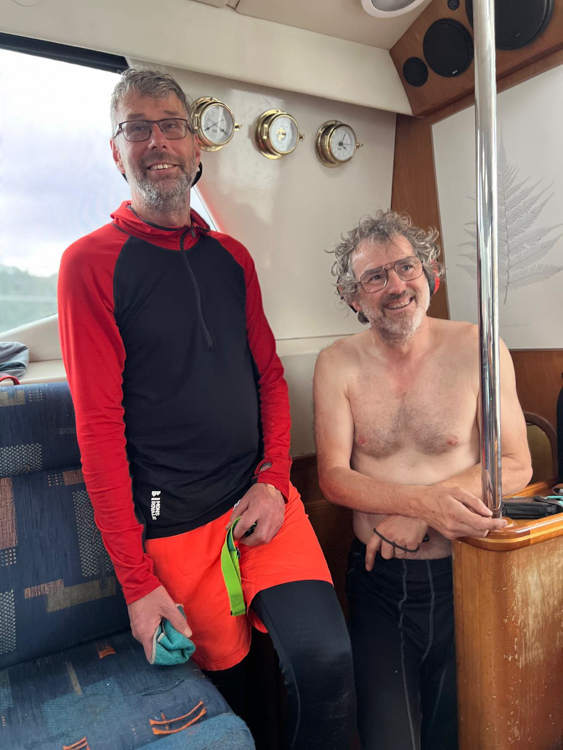 Pieter and Reinhard emerge from the engine room in Schooner Cove