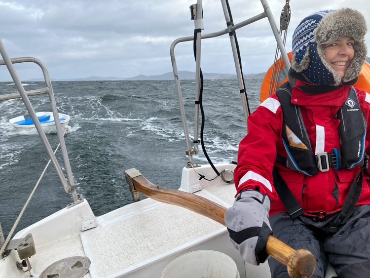 Bronwyn at the helm of Cheval de Mer with a following sea