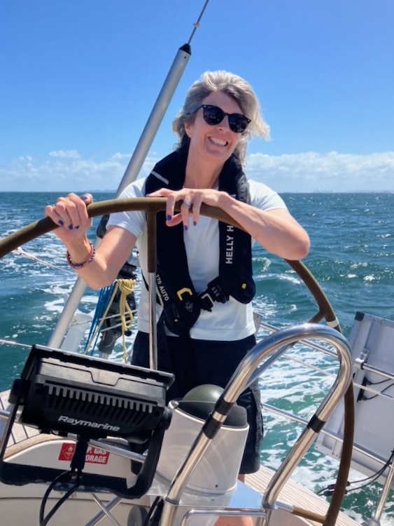 Bronwyn at the helm, sailing to Moreton Island