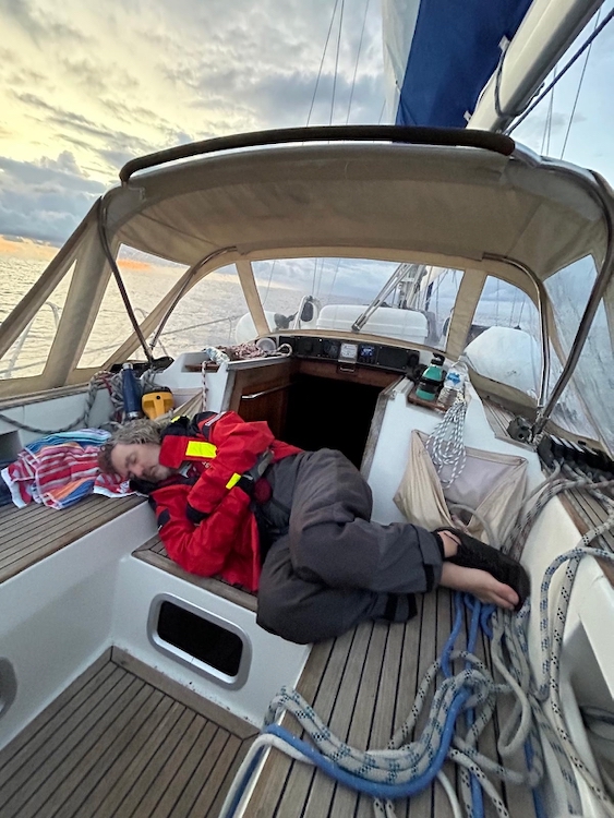 Reinhard sleeping in the cockpit while sailing south in Vestlandskyss